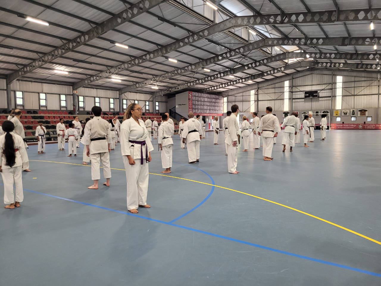 Large group practising kata in formation at the September 2025 gasshuku